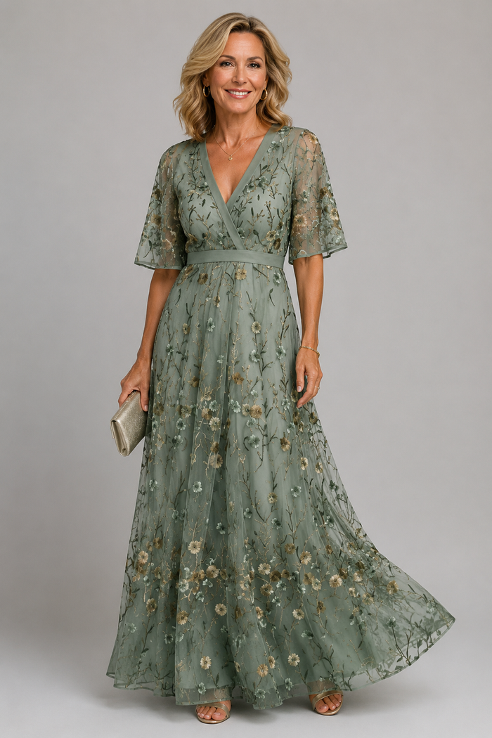 Solenne | Abito midi floreale con collo a halter