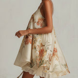 Abito mini A-line in organza floreale beige con bordino in pizzo