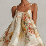 Abito mini A-line in organza floreale beige con bordino in pizzo