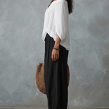 Set Top Bianco Off-Shoulder e Pantaloni Larghi
