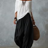 Set Top Bianco Off-Shoulder e Pantaloni Larghi