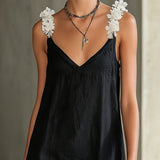 Abito mini nero con scollatura a V e spalline floreali