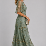 Solenne | Abito midi floreale con collo a halter